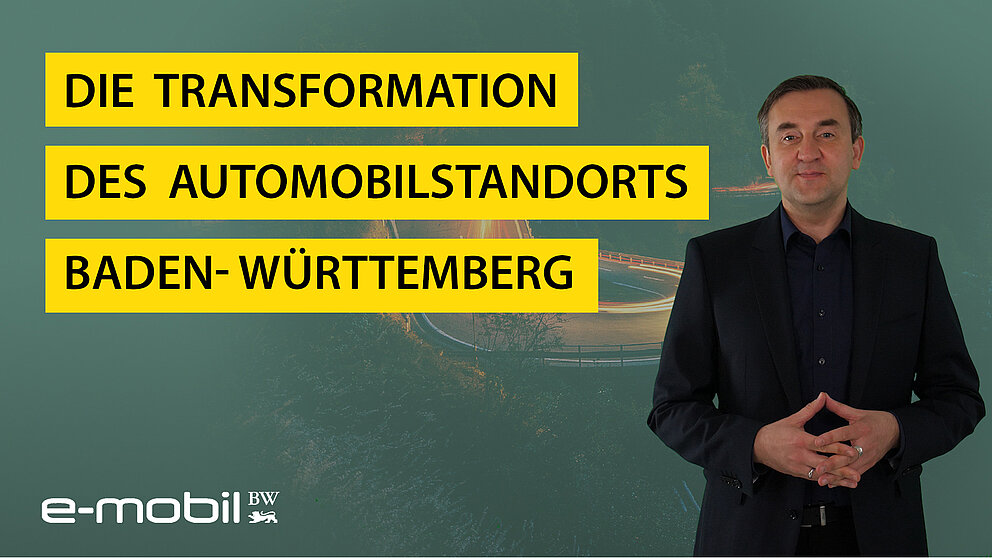 Dr. Wolfgang Fischer blickt lächelnd in die Kamera, er hält seine Hände geschlossen und berichtet zur Transformation des Automobilstandorts Baden-Württemberg.